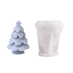 Christmas tree silicone candle mold with finished blue tree model on white background