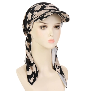 Detail of trendy headscarf hat with visor and beige camo pattern tied at back