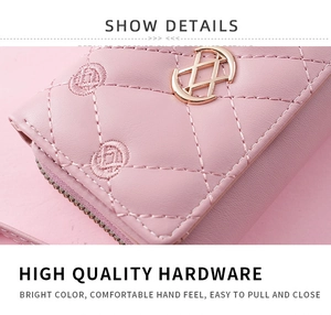 Close-up of pink quilted leather wallet with gold hardware and smooth zipper detail