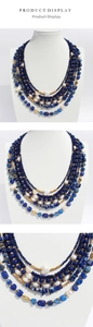 Macro shot of layered lapis lazuli beads with baroque pearls and gold spacer details
