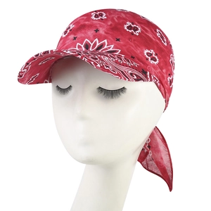 Detail view of red paisley bandanna hat with lightweight fabric and baseball cap brim