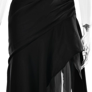 Detailed view of elegant black satin fabric featuring sophisticated pleated ruffles on dress