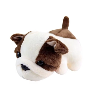 Cute brown and white bulldog plush keychain toy in a lying position on white background
