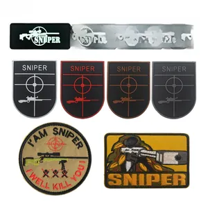 Close-up of tactical sniper morale patches with velcro backing for military gear