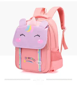 Detail view of pink unicorn backpack with rainbow webbing and side mesh pockets