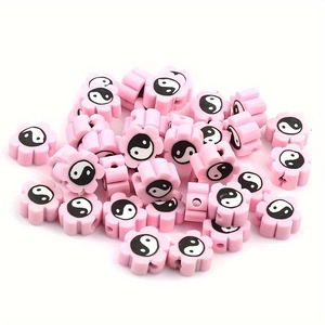 Pink flower-shaped 10mm clay beads with black and white Tai Chi Yin Yang patterns for DIY