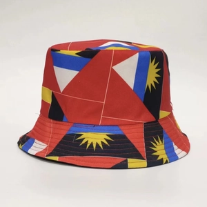 Close-up of Antigua and Barbuda flag pattern printed on a red reversible bucket hat