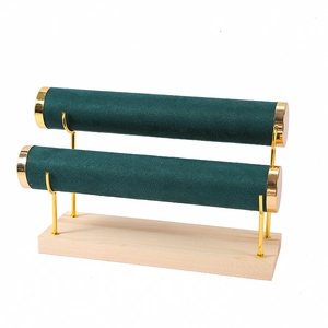 Double-tier dark green velvet bracelet display stand with gold metal frame and wood base