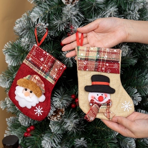Hanging Christmas stockings with 3D Santa and Snowman embroidery on a festive tree