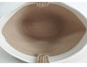 Top view detail of the woven cotton rope texture and spacious interior of the tote bag