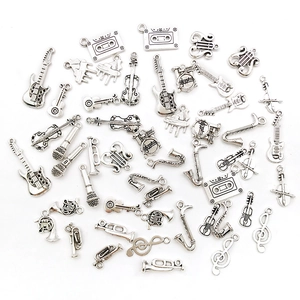 Silver musical instrument charms collection featuring guitar, violin and microphone
