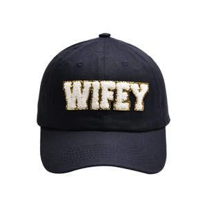 Detail of navy blue cotton baseball cap with gold-edged WIFEY chenille embroidery patch