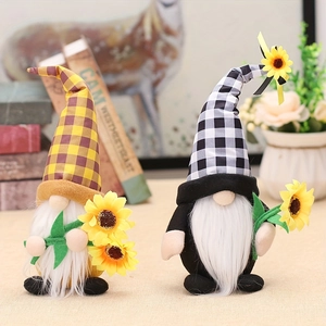 Close-up of sunflower gnomes with plaid hats and plush fabric for home decoration