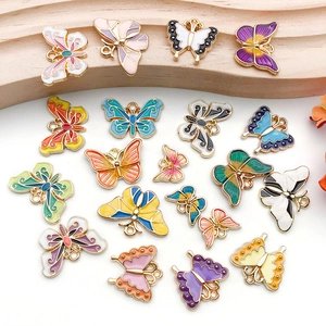 Macro shot of colorful enamel butterfly pendants with hanging holes for DIY jewelry