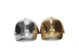 Detail of PU leather baseball cap with metallic hexagon grid pattern in silver and gold