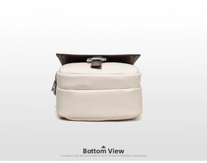 Bottom and side view of mini cream and brown crossbody phone bag with silver hardware