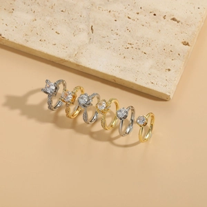 Detailed view of luxury six-piece ring set with gold and silver finishes and zircon stones