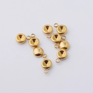 Detailed macro shot of eight golden stainless steel birthstone charm settings for DIY jewelry