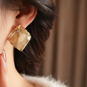 Elegant gold plated square stud earrings with textured mesh surface for women
