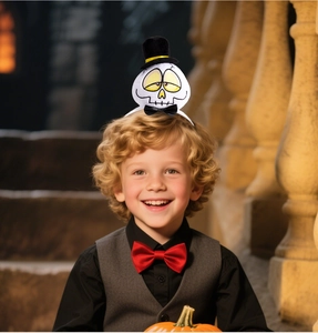 Child wearing Halloween skull headband with black top hat in a warm festive setting