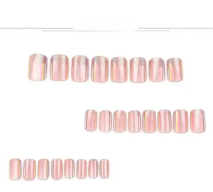 Flat lay showing 24pcs of square pearlescent aurora fake nails in pink metallic finish