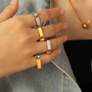 Minimalist adjustable open rings set in gold and silver finish with geometric shapes