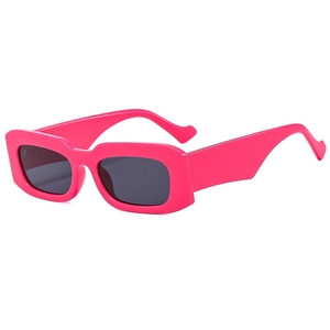 Retro bright pink rectangular sunglasses with dark grey lenses in a minimalist Y2K style