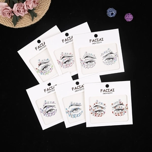 Macro detail of six colorful acrylic facial gemstone sets on black background display
