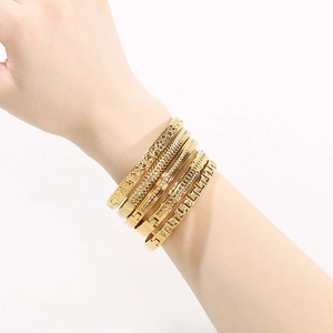 Close-up of luxury 18K gold plated stainless steel bracelets set with sparkling zircons