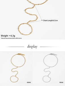 Macro shot of gold and silver beaded hand chain jewelry with precise measurements