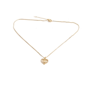 Detail of gold heart pendant with Hamsa hand and sparkling crystals on box chain