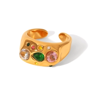 Macro shot of gold stainless steel ring with hammered texture and colorful zircon stones