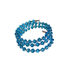Three-layer stretch beaded bracelet with faceted blue crystals and silver spacers