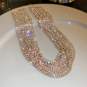 Detail of multi-row colorful rhinestone choker necklace with shiny gold base