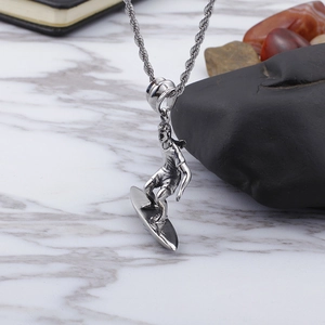 Men's punk style silver stainless steel necklace with a surfer on surfboard pendant