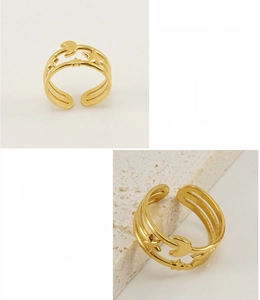 Close-up of 18K gold plated stainless steel ring with moon and star design detail