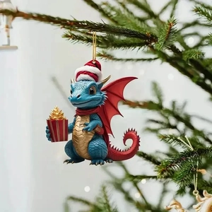 Cartoon blue Christmas dragon ornament with red wings hanging on a festive tree branch