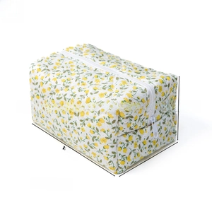 Detail showing dimensions of the quilted floral cosmetic bag with measurements and weight