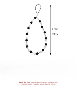 Detail view of 20cm crystal beaded phone strap with black and white resin flower charms