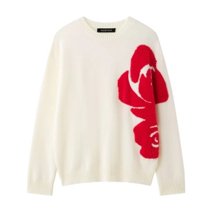 Detail of red plush floral pattern on cream knit sweater with crew neck and long sleeves