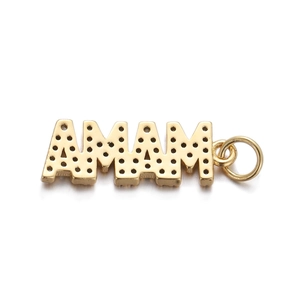 Macro shot of gold-plated MAMA letter pendant with textured surface on white backdrop