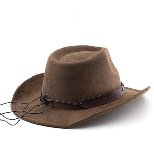 Close-up of brown suede cowboy hat with leather band and blue bead decoration