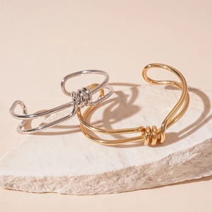 Minimalist double-layered geometric knot open cuff bracelet in gold and silver finish