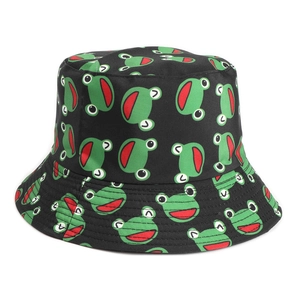 Close-up of black bucket hat featuring green cartoon frog patterns and red mouth details
