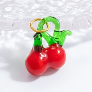 Handmade cherry glass pendant with red fruit and green leaves on gold metal ring