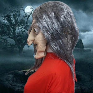 Detailed side view of scary witch latex mask with long pointed nose and grey hair