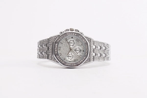 Macro shot of silver diamond-encrusted watch with Roman numerals and three sub-dials