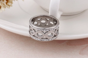 Detail of silver titanium steel ring featuring double row zircon and hollow design