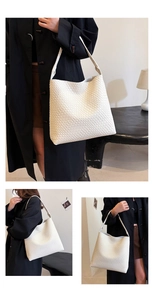 Detail showing the white woven leather texture and square pattern of the large shoulder bag
