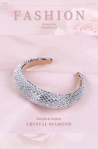 Detailed shot of full silver rhinestone headband on soft brown velvet with pink petals